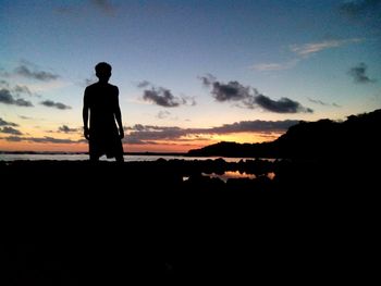 Silhouette of people at sunset