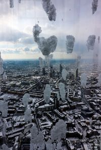 Aerial view of buildings in city during winter