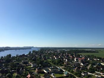 High angle view of townscape against clear blue sky