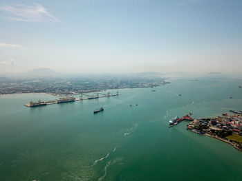 High angle view of boats in sea against sky