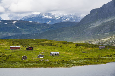 Huts in green mountain landscape