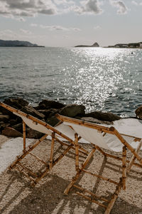 View of chairs on beach
