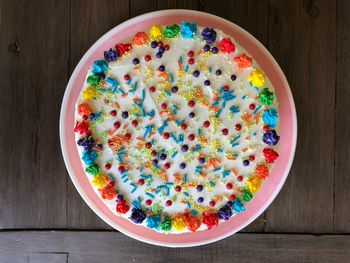 High angle view of multi colored candies in bowl on table
