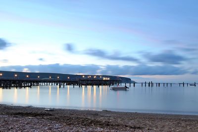 Pier over sea against sky