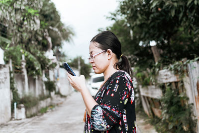 Young woman using mobile phone