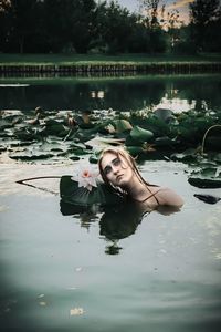 Young woman swimming in lake