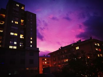 Low angle view of illuminated building against sky at night