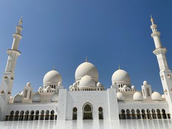 Low angle view of mosque against clear sky