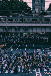 High angle view of people on street against buildings in city