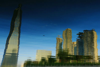 Low angle view of buildings against blue sky