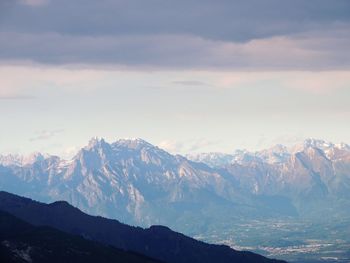 Scenic view of snowcapped mountains against sky