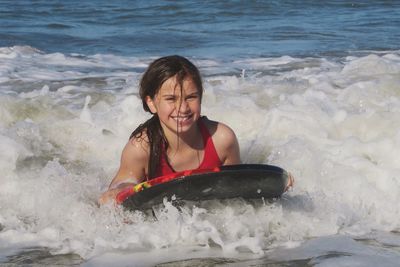 Portrait of young woman in sea