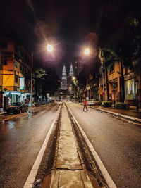 View of light trails on road at night