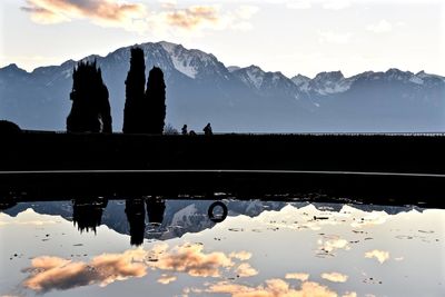 Scenic view of lake in front of mountains