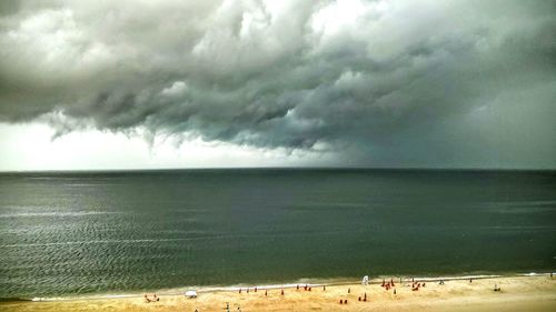 Scenic view of sea against cloudy sky