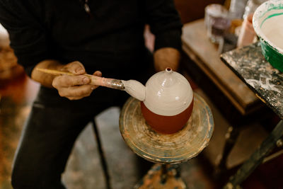 Midsection of man preparing food