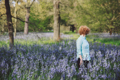 Young woman standing in lavender field