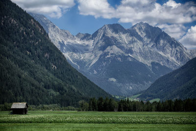 Scenic view of snowcapped mountains against sky