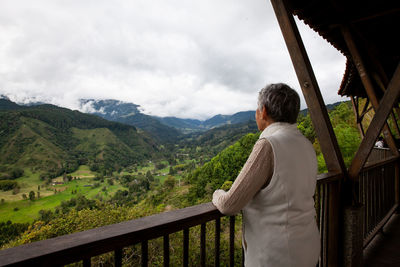 Senior woman at the beautiful view point over the cocora valley in salento  in colombia