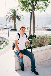 Portrait of young man using mobile phone