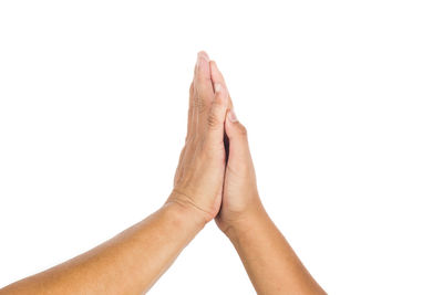 Close-up of human hand against white background