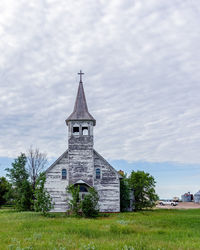 Church on field against sky