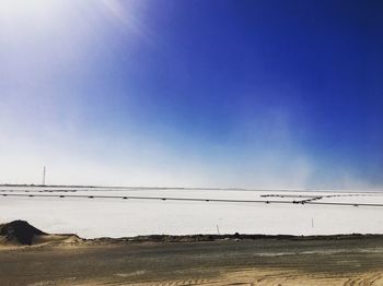 Scenic view of beach against clear sky