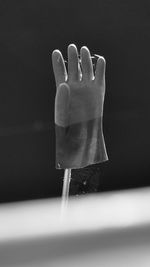 Close-up of glove in darkroom