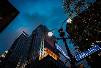 Low angle view of illuminated buildings against sky