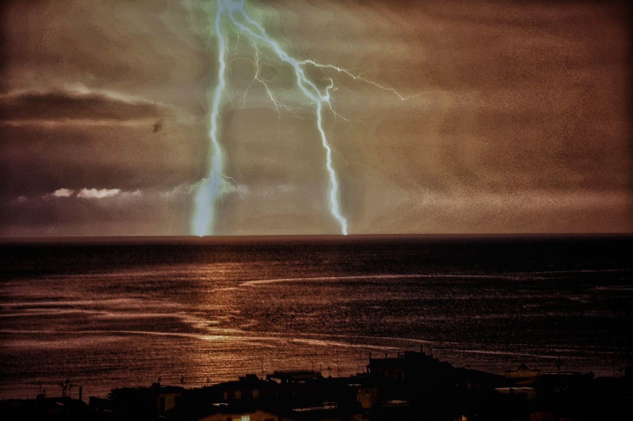 VIEW OF STORM CLOUDS OVER SEA