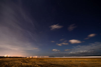 Scenic view of a beach landscape against sky at night