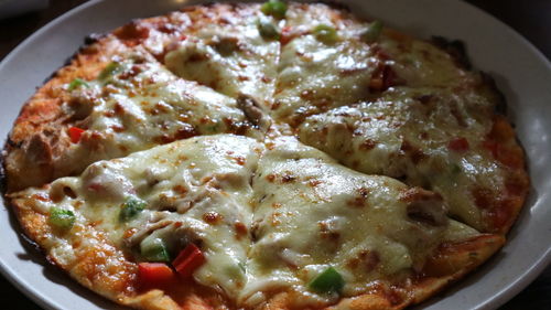 High angle view of pizza in plate on table