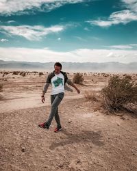 Full length of man standing on land