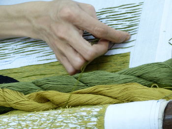 Close-up of woman making embroidery