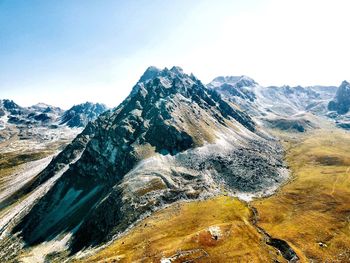 Scenic view of snowcapped mountains against clear sky