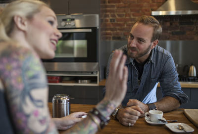 Young couple preparing coffee