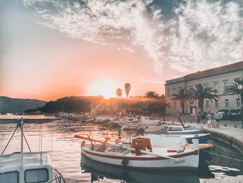 Panoramic view of restaurant and buildings against sky during sunset