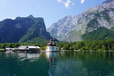 Scenic view of lake and mountains against sky