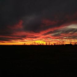 Silhouette of landscape against dramatic sky