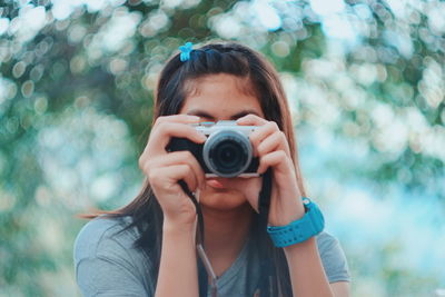 Close-up of a man holding camera