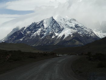 Scenic view of snowcapped mountains against sky