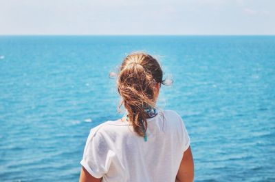 Rear view of woman looking at horizon
