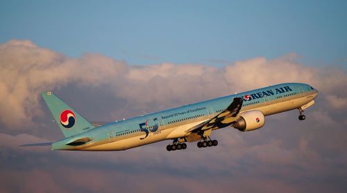 Side view of airplane against sky