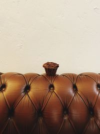 Close-up of leather on table against wall at home