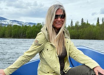 Portrait of a smiling young woman in lake