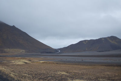 Scenic view of landscape and mountains against sky