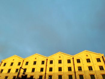 Low angle view of building against blue sky