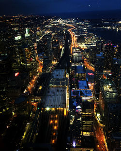 High angle view of illuminated buildings in city at night