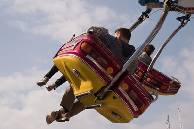 Low angle view of child playing against sky