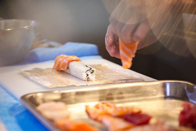 Man preparing food on cutting board